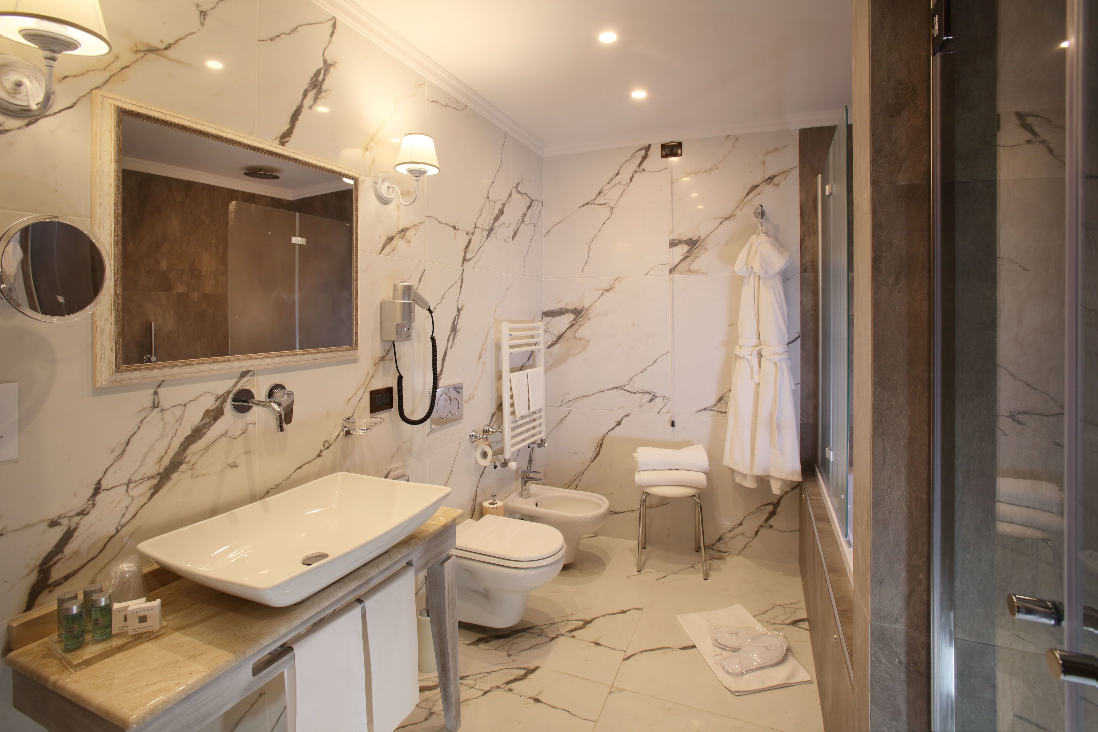 junior studio suite | bathroom | designer toiletries, hair dryer, bathrobes, slippers