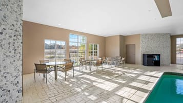 Indoor pool, open 10:00 AM to 9:00 PM, pool loungers