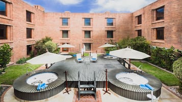 Outdoor pool, open 7:30 AM to 7 PM, pool umbrellas, pool loungers