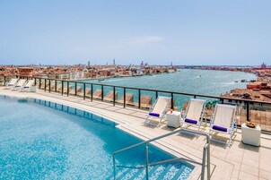 Seasonal outdoor pool, pool umbrellas, sun loungers