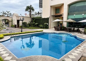 Outdoor pool, open 9:00 AM to 9:00 PM, pool loungers