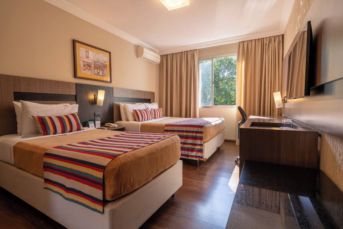 Superior Triple Room | Minibar, in-room safe, desk, laptop workspace