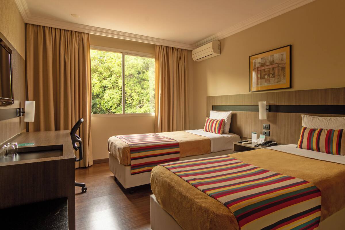 Superior Twin Room | Minibar, in-room safe, desk, laptop workspace