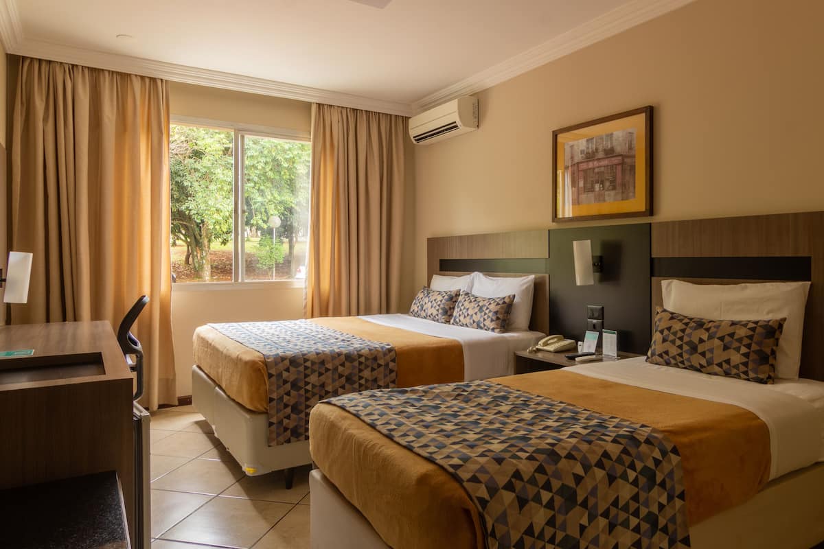 superior triple room | minibar, in-room safe, desk, laptop workspace