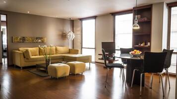 Business Suite, 1 Bedroom, 2 Bathrooms | Living room | 45-inch LCD TV with satellite channels, TV, DVD player