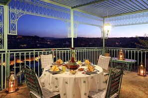 Enjoy a romantic dinner with a city view in this semi- outdoor dining area.