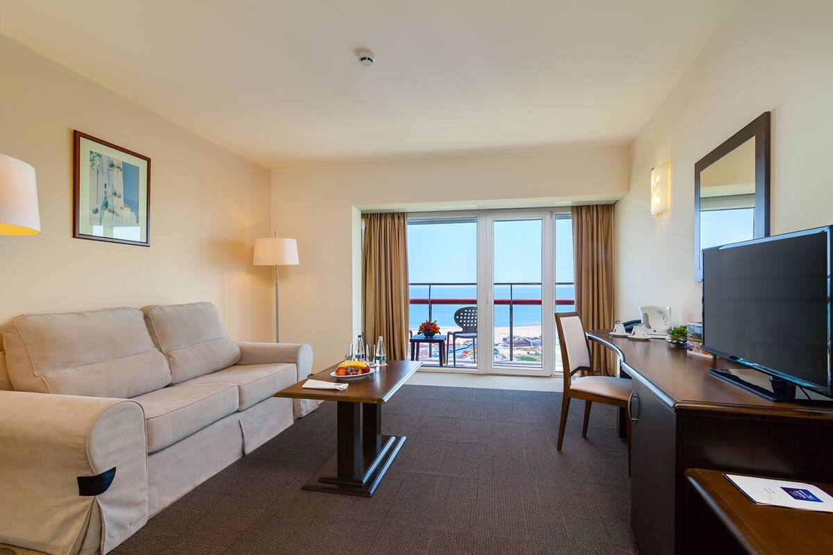 standard double or twin room | living area | flat-screen tv