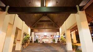 A hotel entrance with a wooden staircase leading to a lobby area. - Chiangmai Grandview Hotel & Convention Center (Chiang Mai)