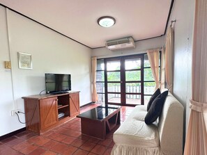Superior Suite, 1 King Bed, Garden View | Living area | 32-inch TV with cable channels - The Legacy River Kwai Resort (Dan Makham Tia)