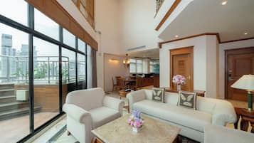Penthouse Suite, 3 Bedroom | Living area | 32-inch LCD TV with cable channels, TV, pay films