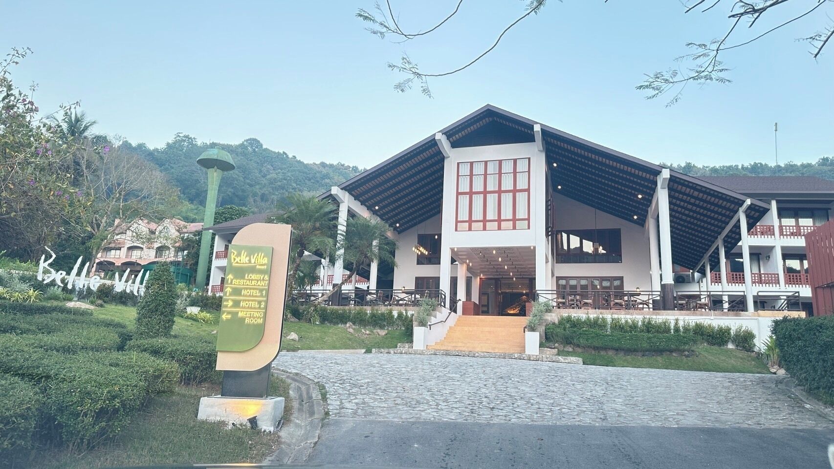 A hotel with a modern design, featuring a lobby, restaurant, and multiple meeting rooms.