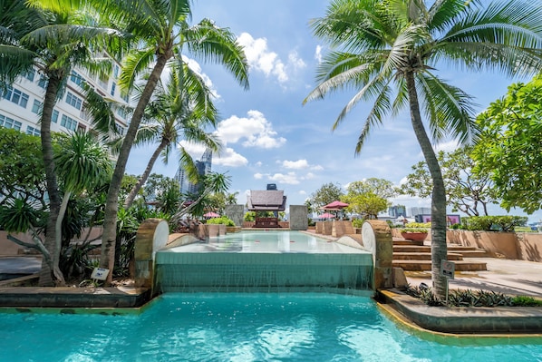 Outdoor pool, open 7:00 AM to 9:00 PM, pool umbrellas, sun loungers