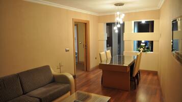 Suite, 1 King Bed | Living room | Pay movies