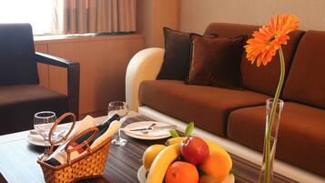 Suite, 1 King Bed | Living area | Pay films