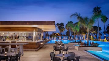 2 bars/lounges, poolside bar, beach bar