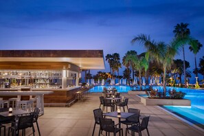 A poolside bar area with outdoor seating and a pool. - Acanthus Cennet Barut Collection - Ultra All Inclusive (Manavgat)