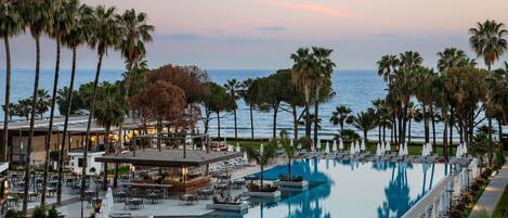 Indoor pool, seasonal outdoor pool, pool umbrellas, pool loungers
