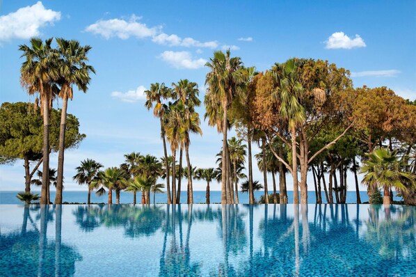 Indoor pool, seasonal outdoor pool, pool umbrellas, pool loungers