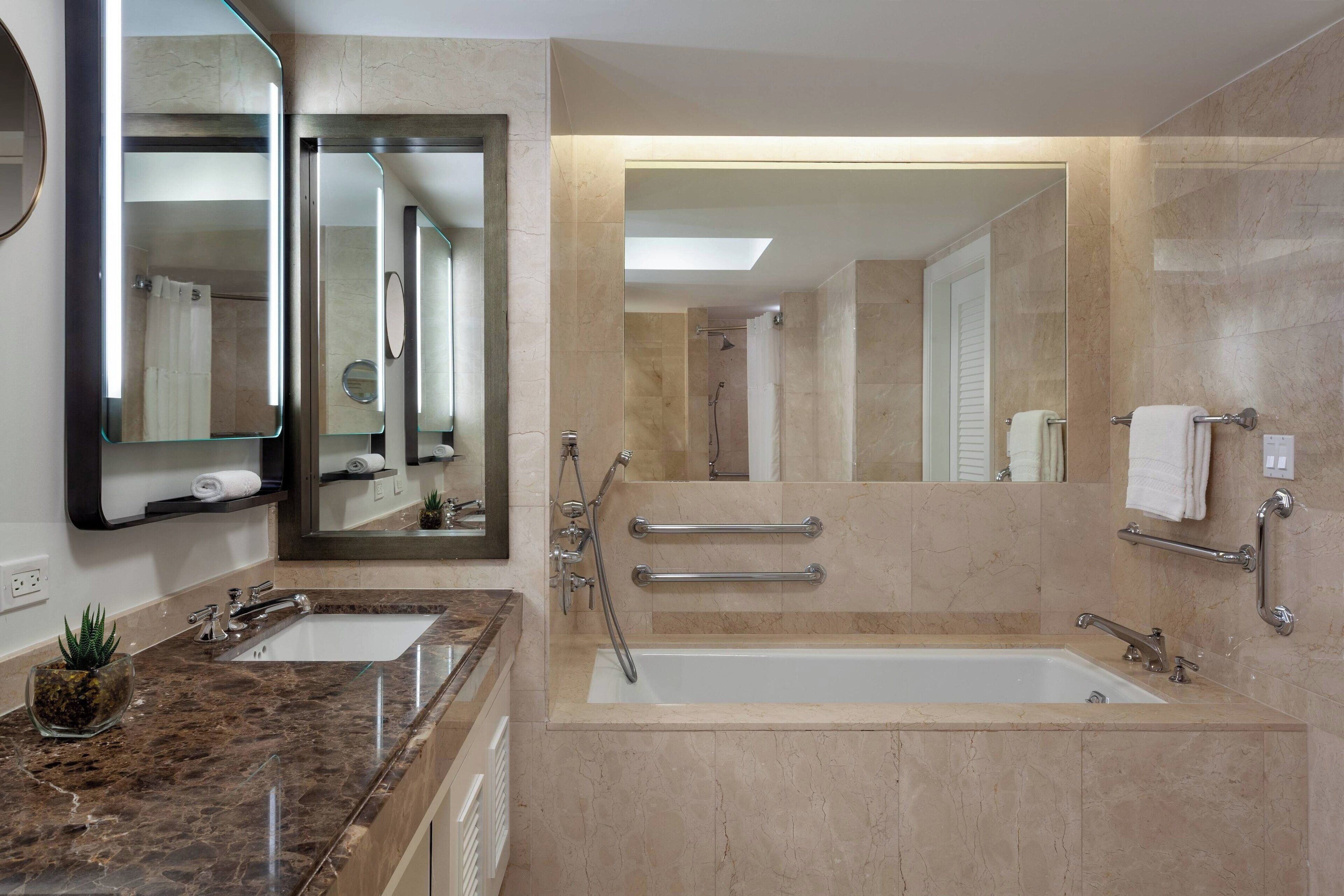 separate bathtub and shower, deep-soaking bathtub, designer toiletries