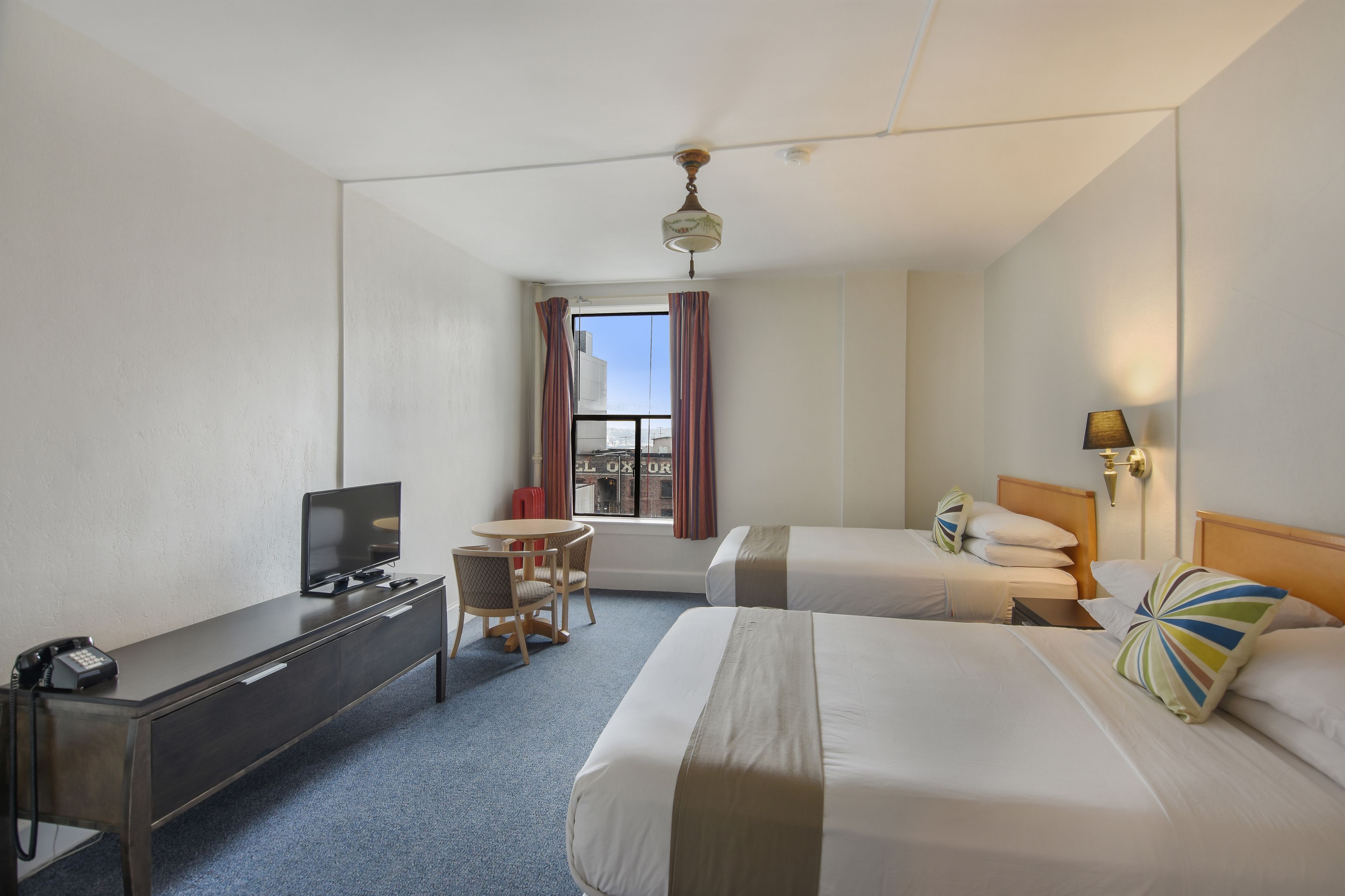 standard room, 2 queen beds, private bathroom | individually decorated, individually furnished, iron/ironing board