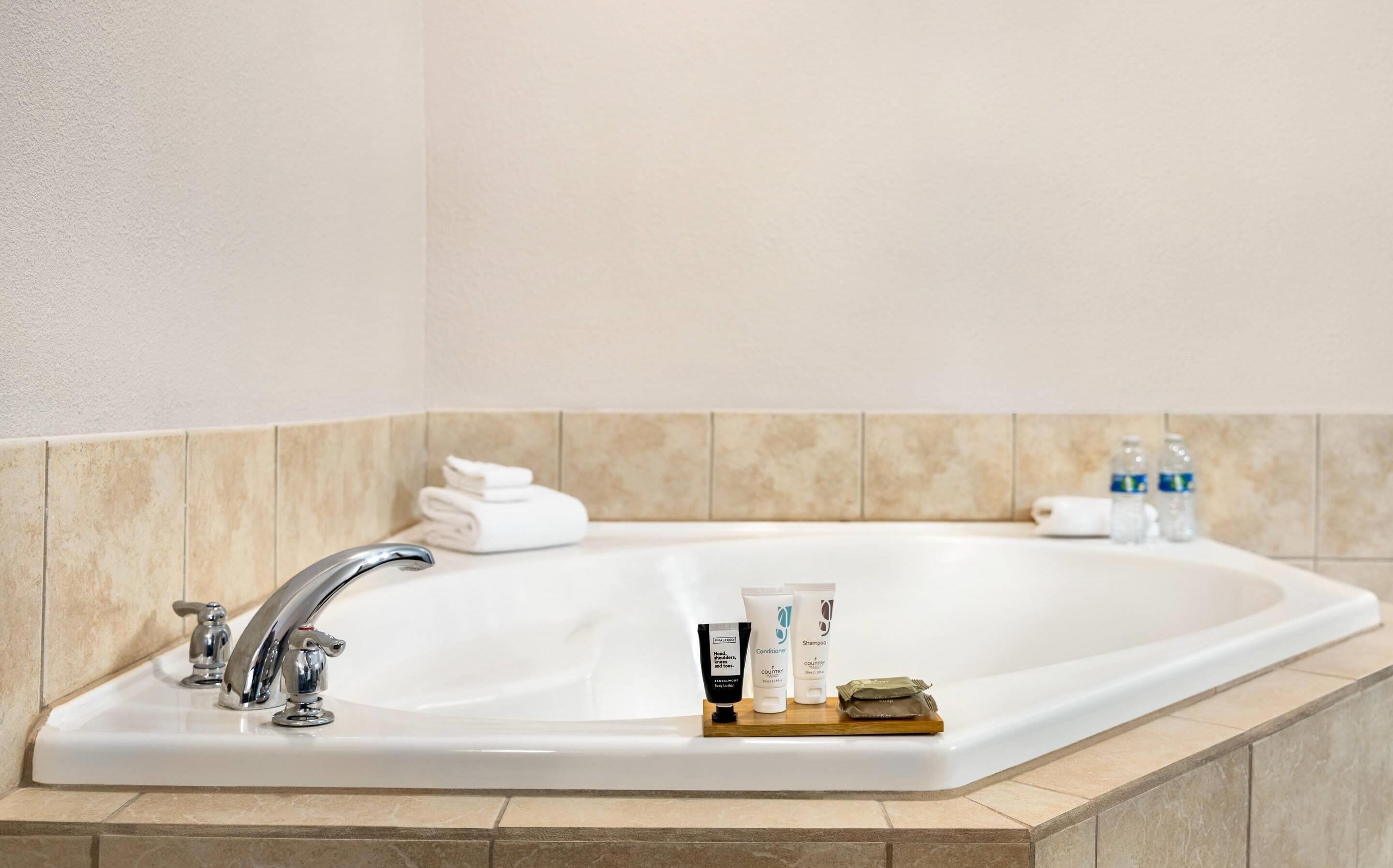 suite, 1 king bed, non smoking, jetted tub | 1 bedroom, desk, blackout curtains, iron/ironing board