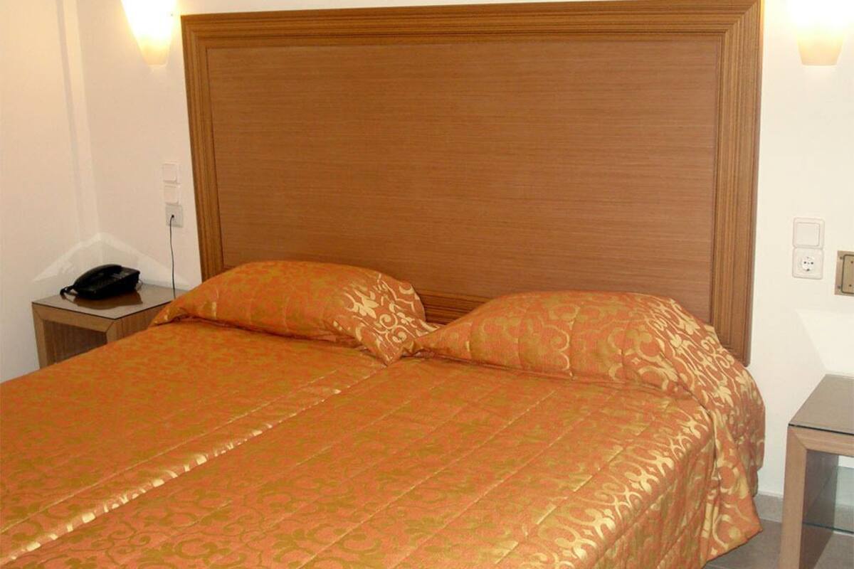 Standard Triple Room | Minibar, in-room safe, desk, soundproofing