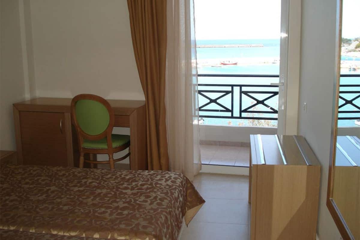 Standard Room, Partial Sea View | Minibar, in-room safe, desk, soundproofing