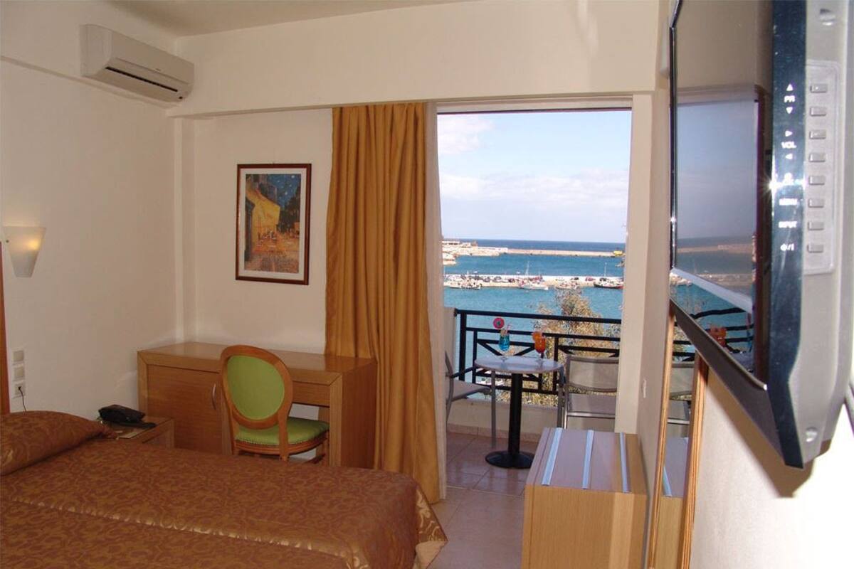 Standard Triple Room, Sea View | Minibar, in-room safe, desk, soundproofing