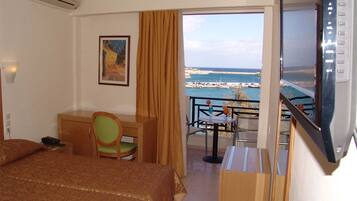 Standard Triple Room, Sea View | Minibar, in-room safe, desk, soundproofing
