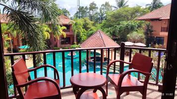 Deluxe Room, Balcony, Pool View | 1 bedroom, premium bedding, minibar, in-room safe