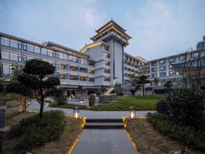 A modern hotel with a central courtyard, multiple floors, and traditional architectural elements. - Holiday Inn Guilin Qixing by IHG (Guilin)
