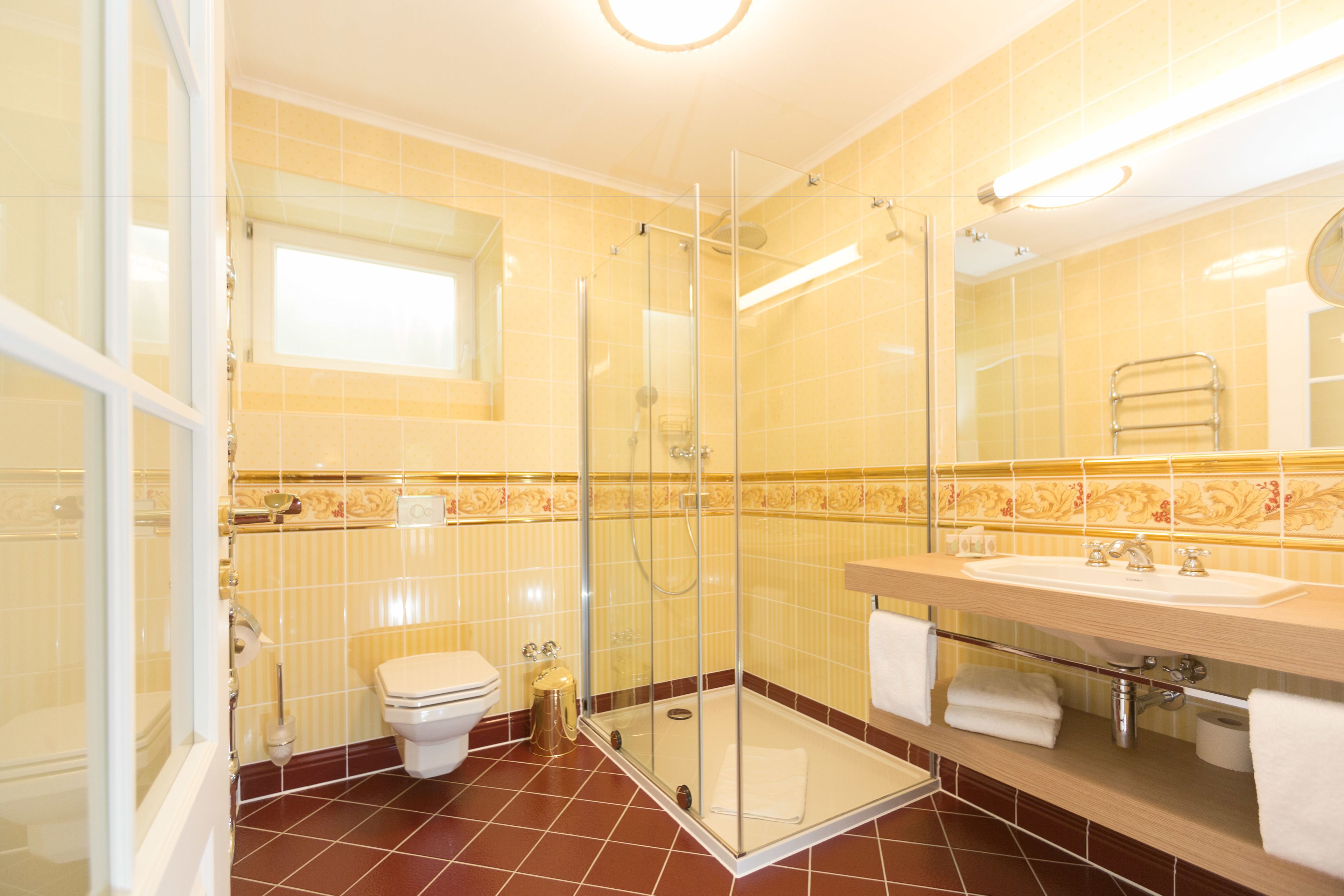 superior family suite | bathroom | shower, free toiletries, hair dryer, towels
