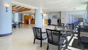 A spacious hotel lobby with a reception desk, seating area, and modern decor. - Aquarius Vacation Club at Dorado del Mar (Dorado)