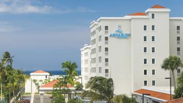 A multi-story hotel with a prominent sign reading "Aquarius Vacation Club".