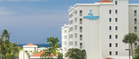 A multi-story hotel with a prominent sign reading "Aquarius Vacation Club".