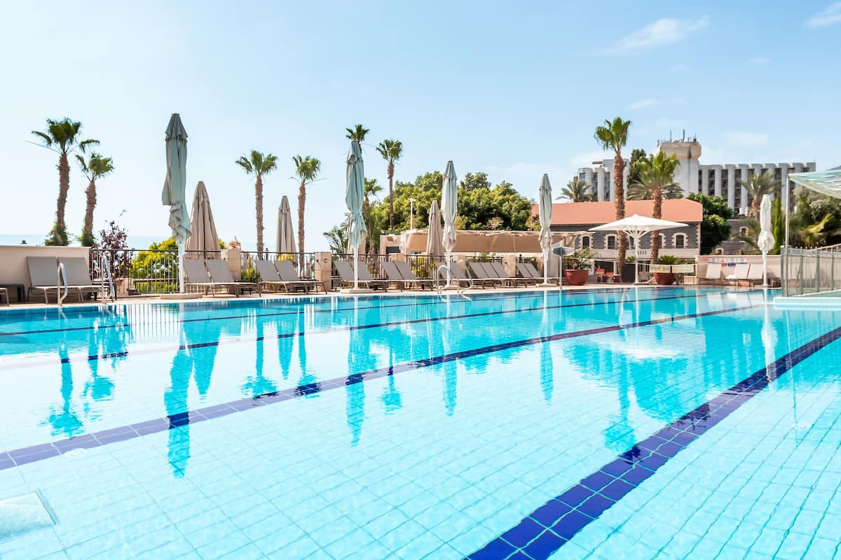 seasonal outdoor pool, pool umbrellas