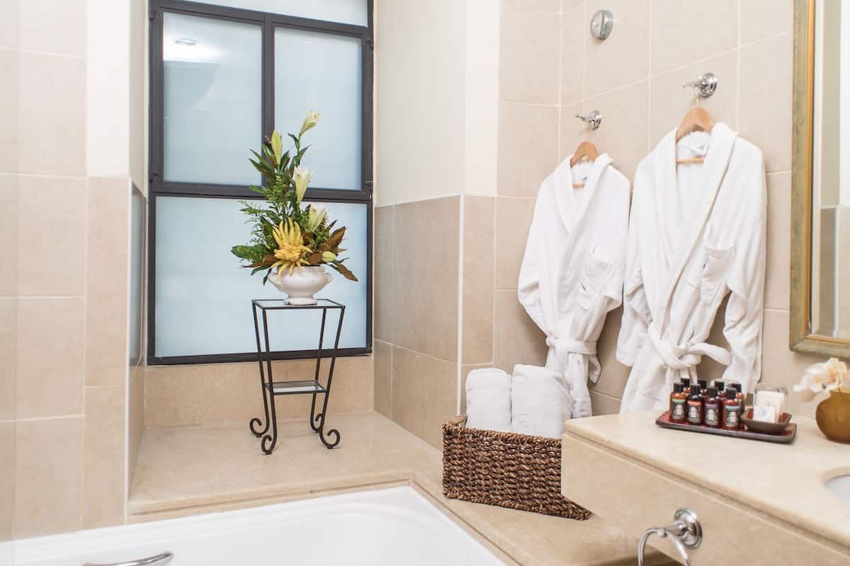 bathtub, rainfall showerhead, free toiletries, hair dryer