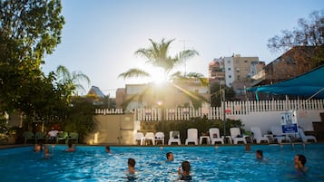 Seasonal outdoor pool, pool umbrellas, pool loungers