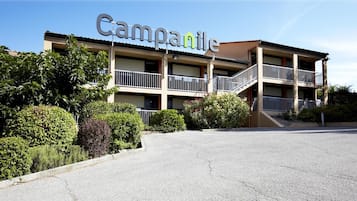 Campanile offers a charming two-story residence with a central staircase and balconies.