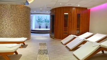 Relax in our serene spa area, featuring massage tables and a peaceful atmosphere.