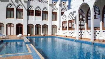 Outdoor pool, open 9:00 AM to 10:00 PM, pool umbrellas, pool loungers