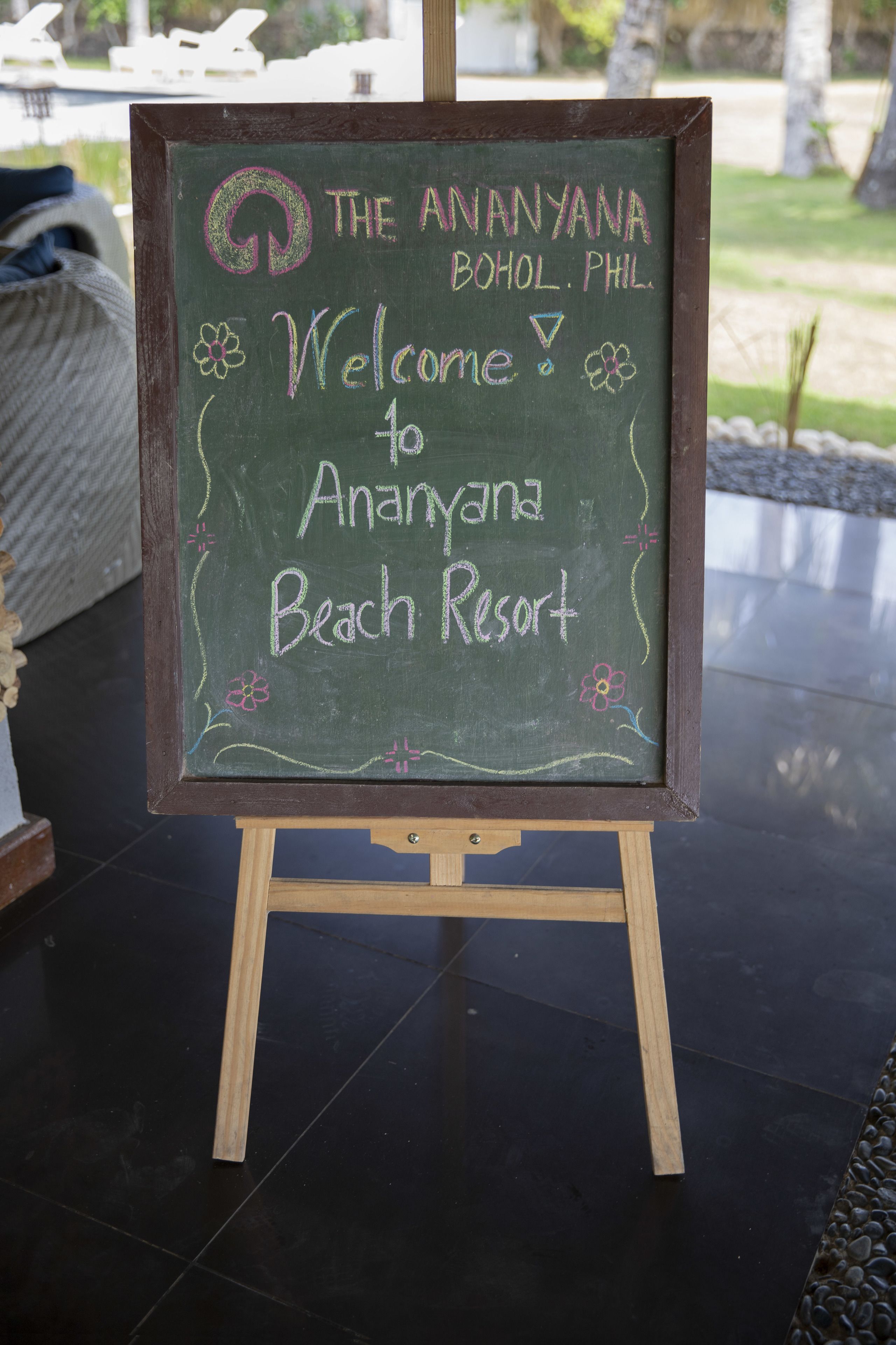 A chalkboard sign welcoming visitors to Ananyana Beach Resort.