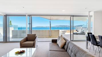 Lake View Two Bedroom Penthouse | Living area | 50-cm flat-screen TV with satellite channels, TV