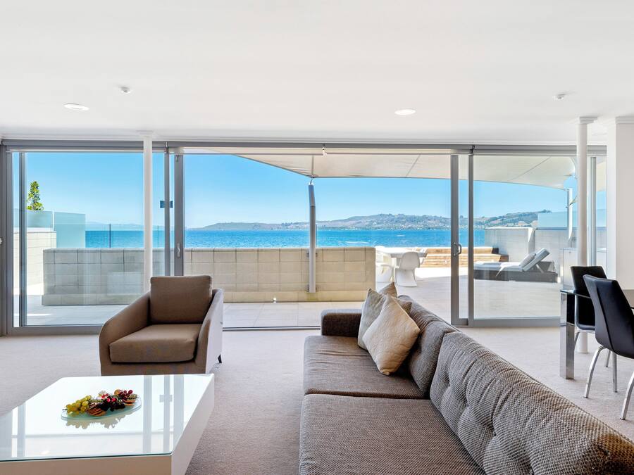 Lake View Two Bedroom Penthouse | Living area | 50-cm flat-screen TV with satellite channels, TV