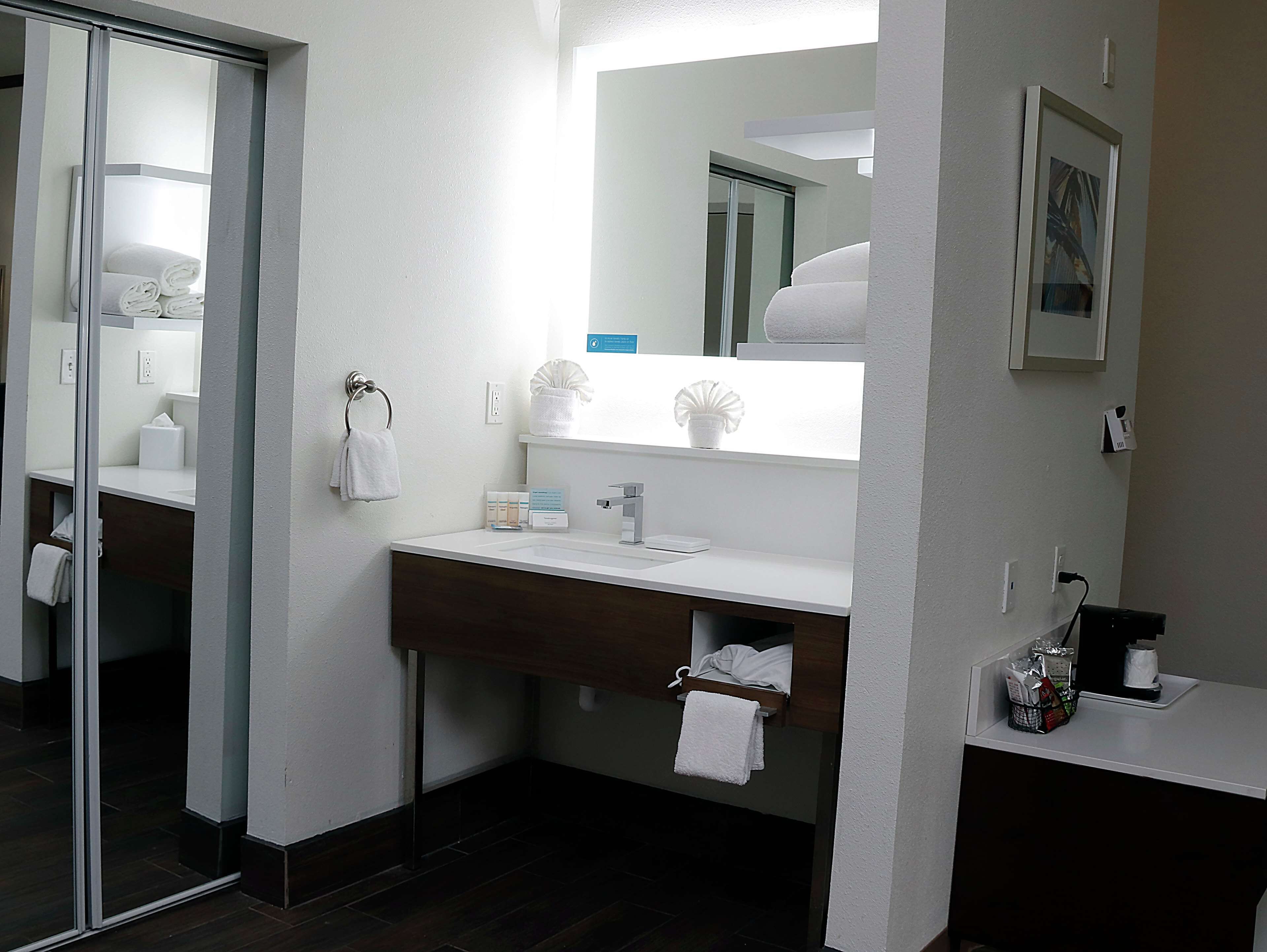 bathtub, hair dryer, towels