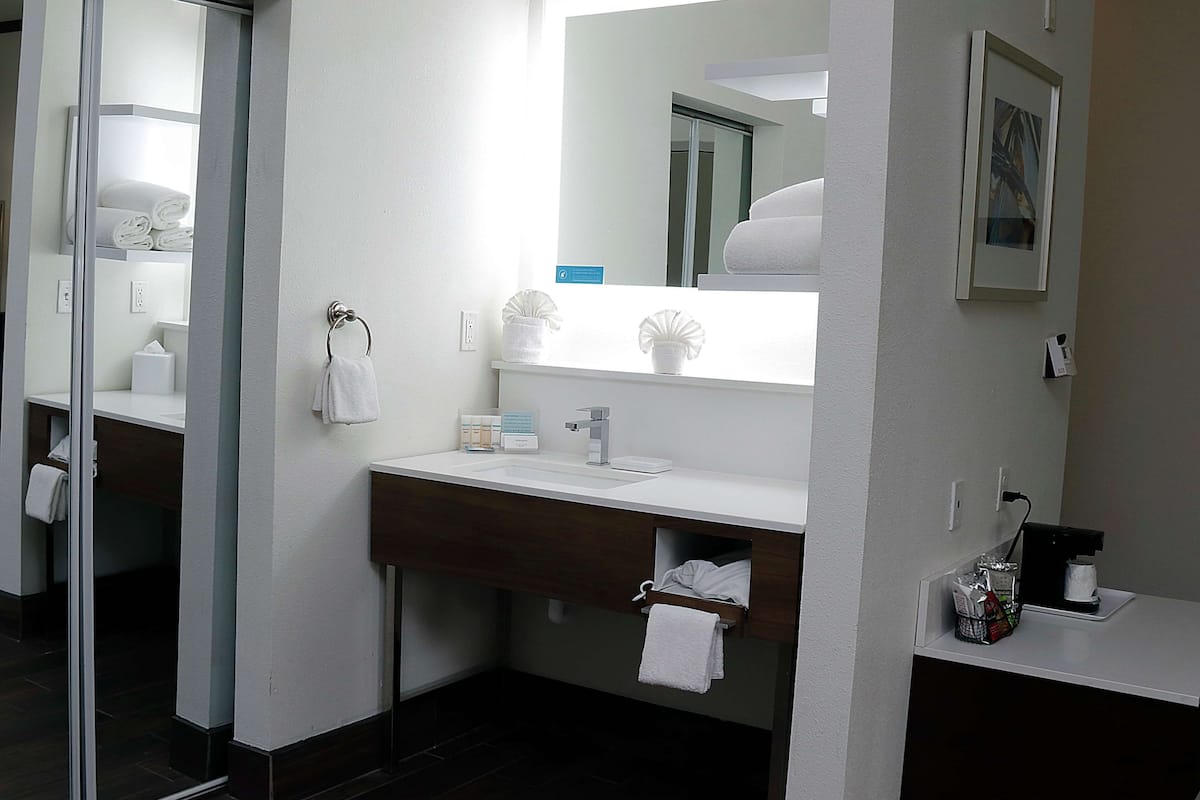 bathtub, hair dryer, towels