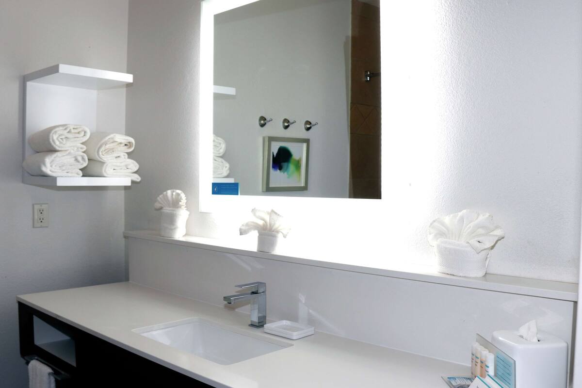 bathtub, hair dryer, towels