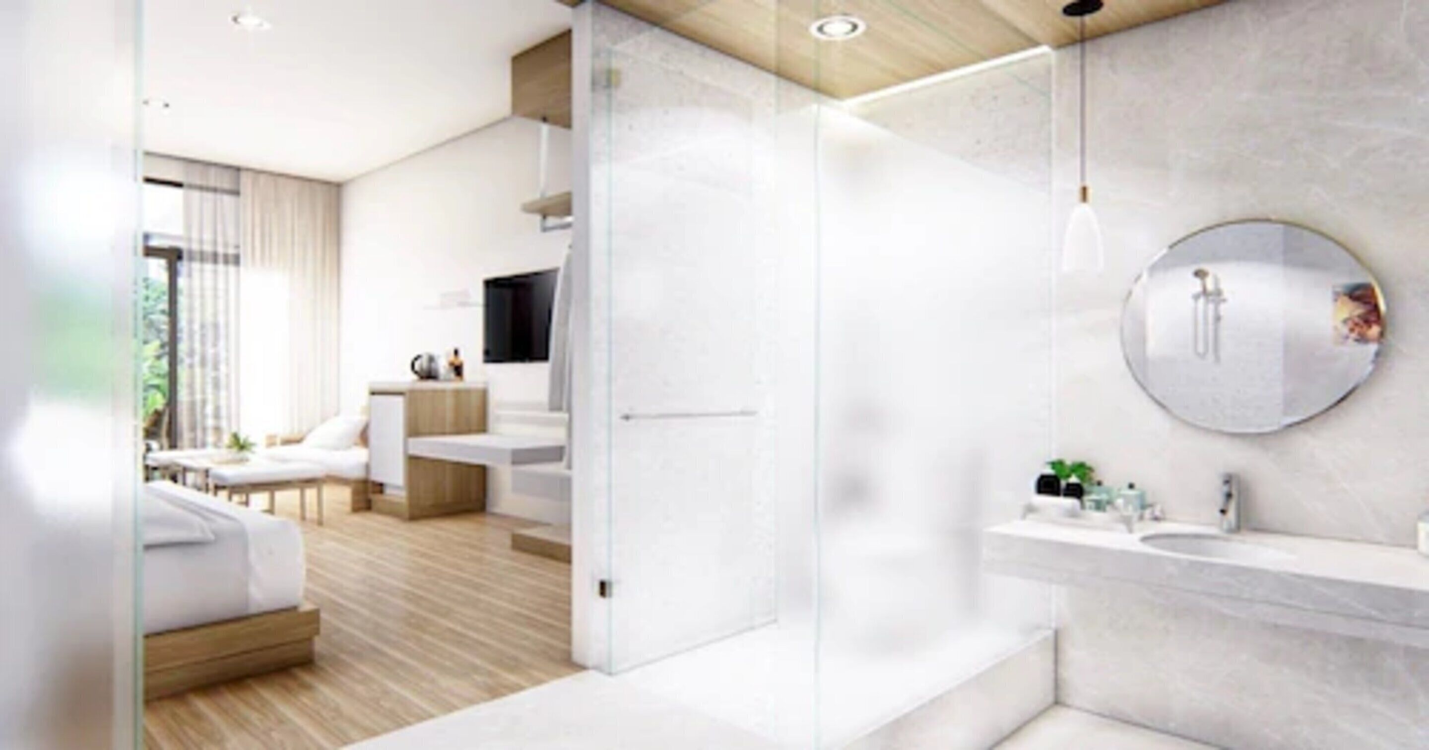 A modern bathroom with a glass shower enclosure, a round mirror, and a marble countertop.