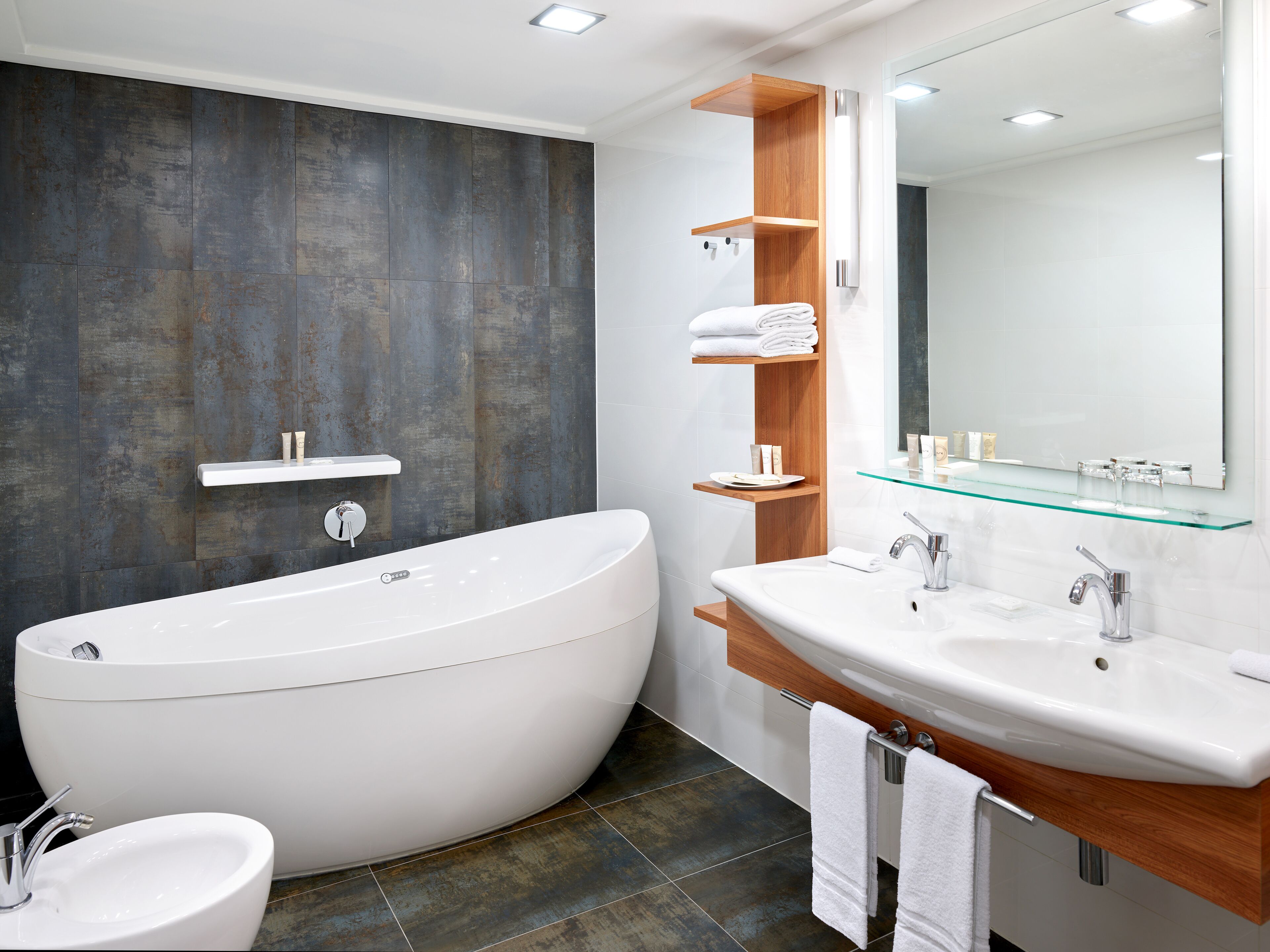 deluxe suite | bathroom | free toiletries, hair dryer, slippers, towels