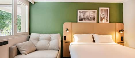 Premium bedding, desk, laptop workspace, blackout drapes